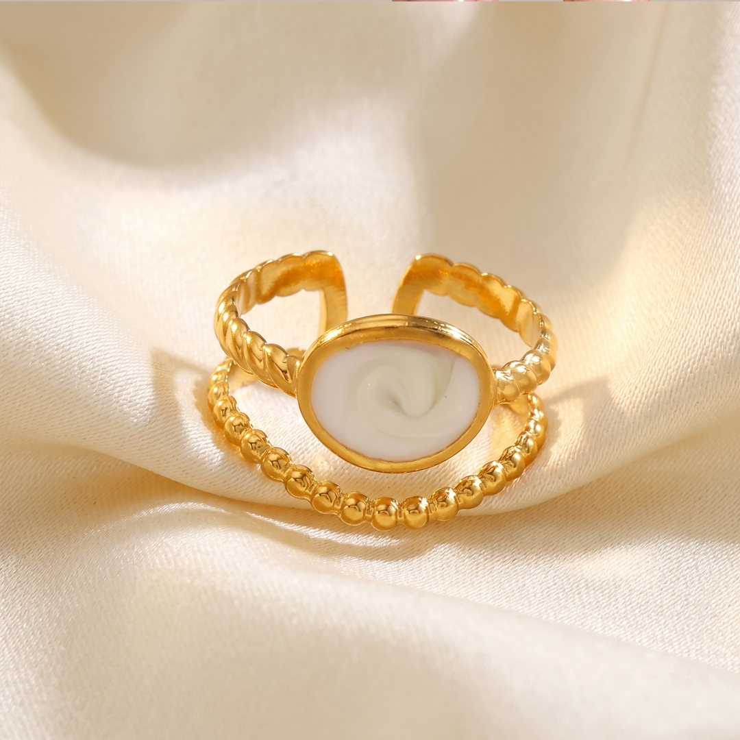 The crest ring resting on cream silk