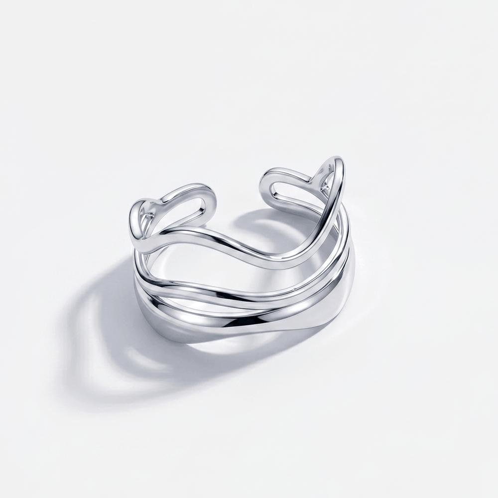 The double wave ring in silver-tone stainless steel, on a plain background