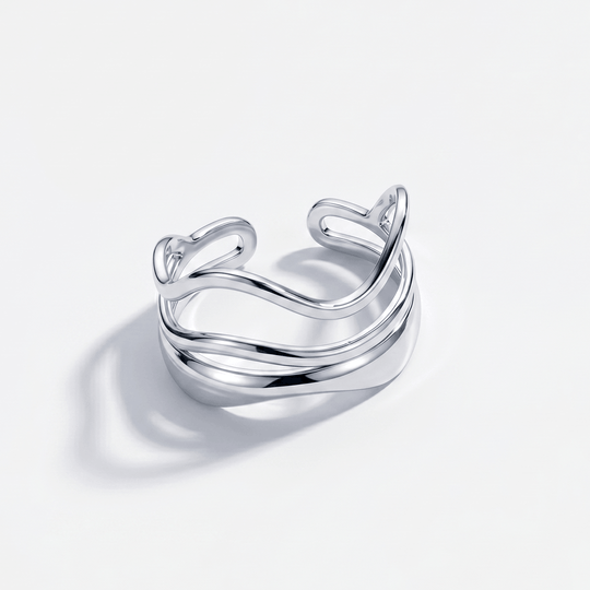 The double wave ring in silver-tone stainless steel, on a plain background