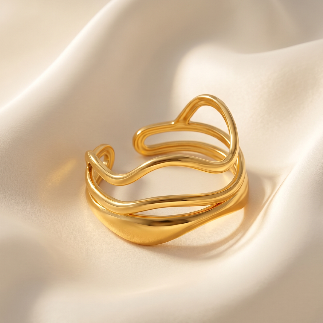 The double wave ring resting on cream silk