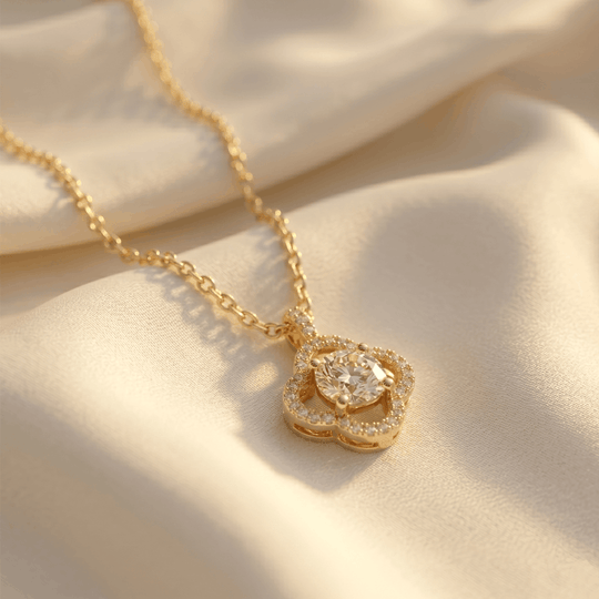The cubic zirconia flower pendant resting on cream silk
