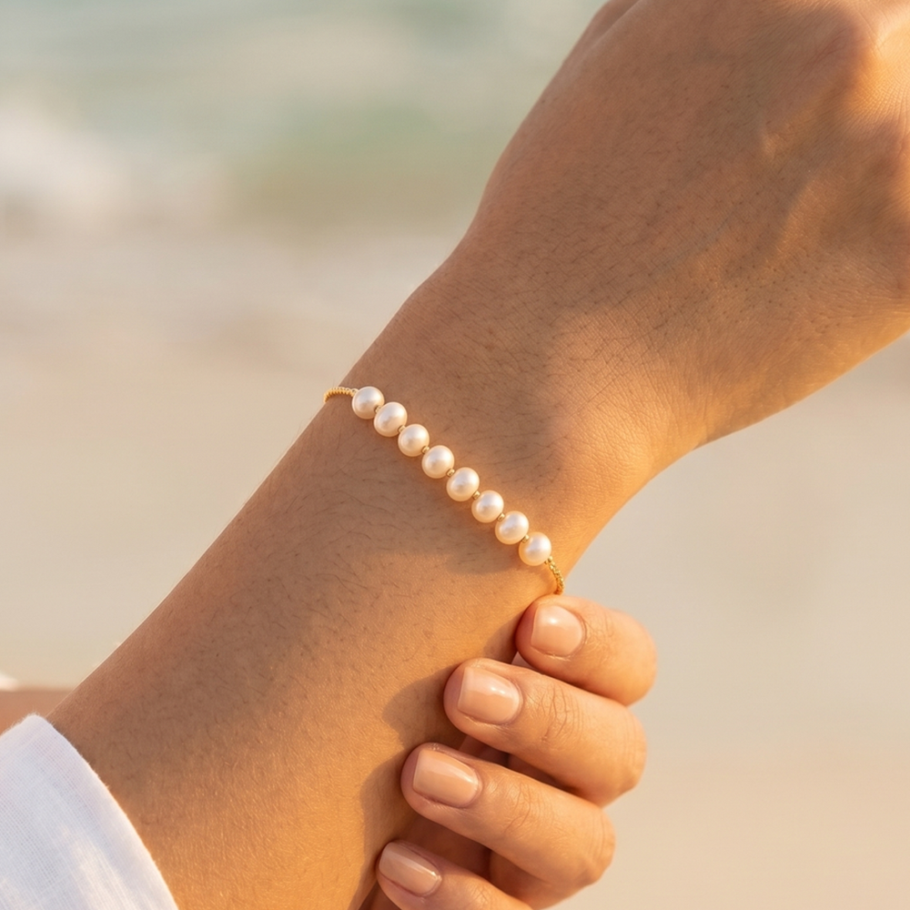 The pearl bracelet worn on the wrist