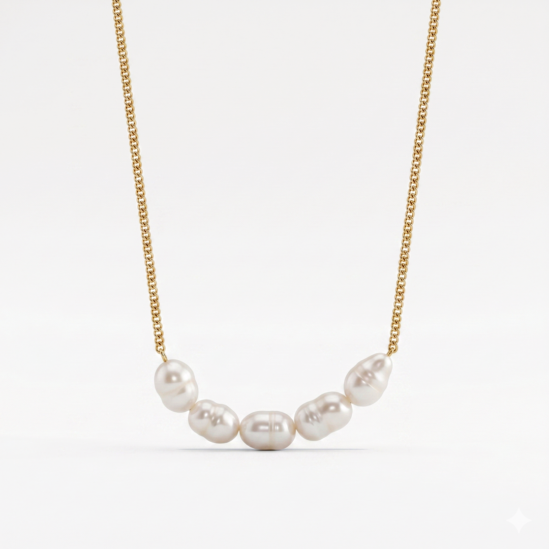 A gold-tone chain necklace with six freshwater pearls gathered at the front, on a plain background