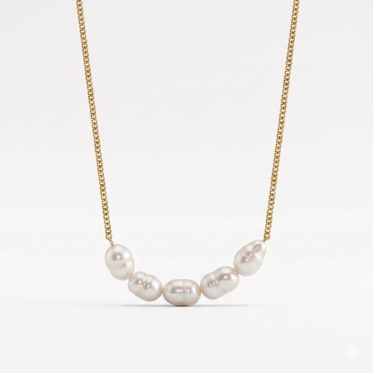 A gold-tone chain necklace with six freshwater pearls gathered at the front, on a plain background