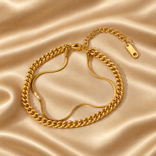 The Rio Layered Bracelet resting on champagne satin
