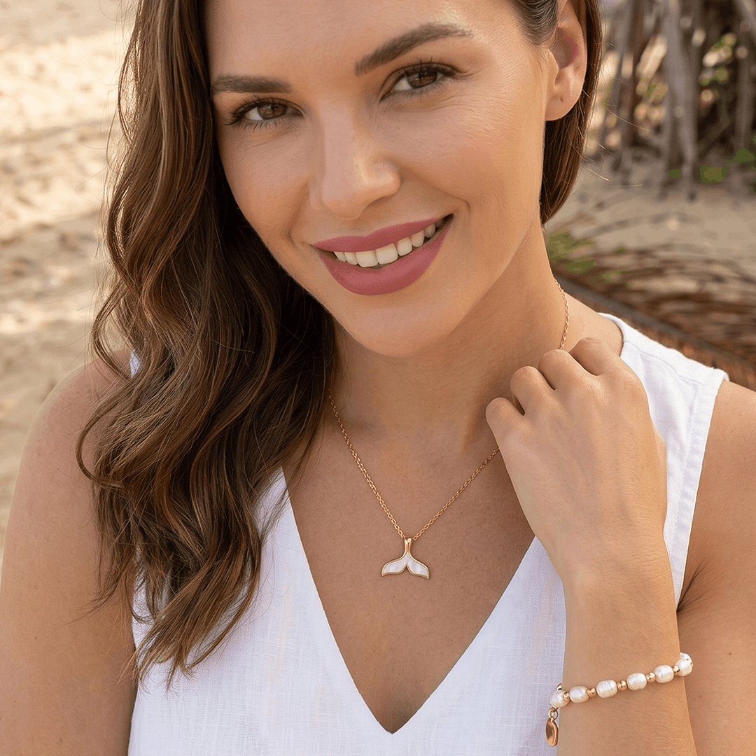 The pearl bead bracelet worn on the wrist