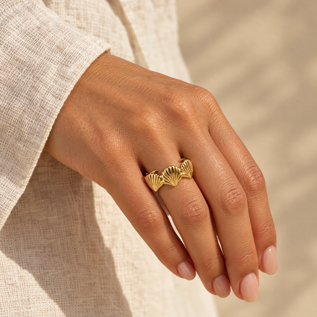 The Bay Scallop Ring worn, seen from the side in afternoon light