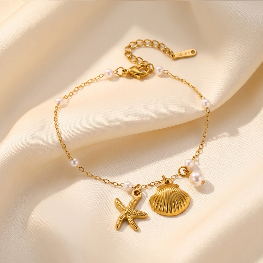 Close detail of the shell, the starfish and the pearl stations