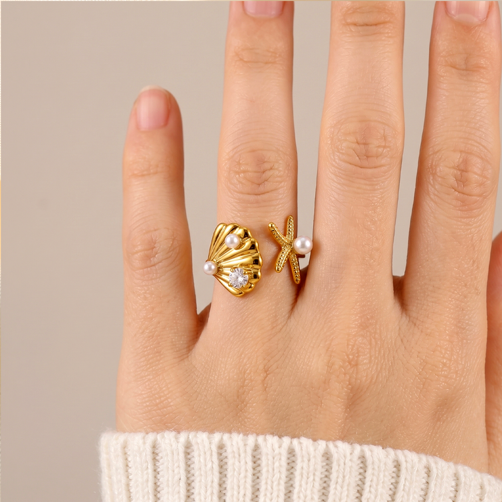 The shell and starfish ring worn on the hand