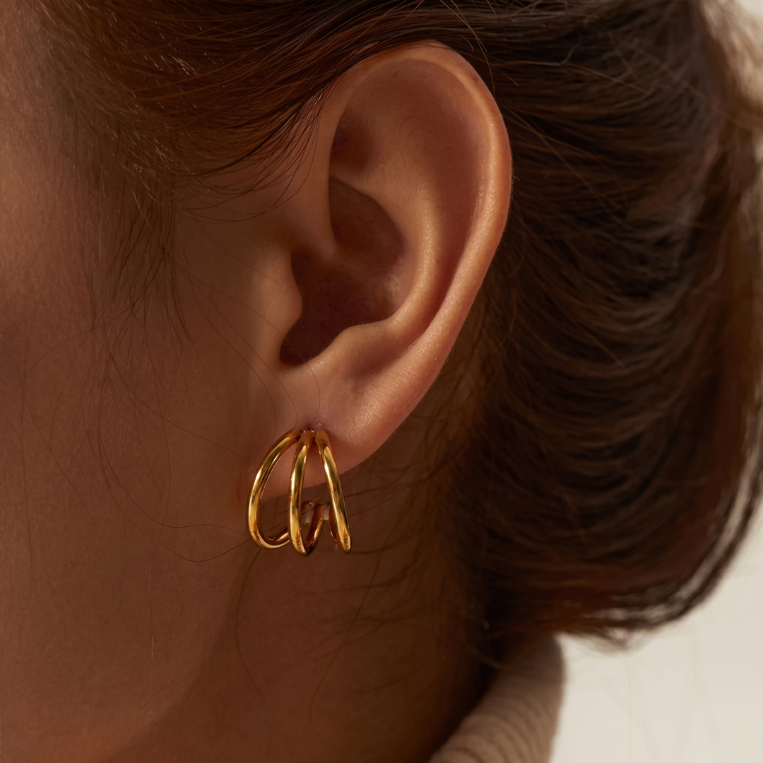 The triple hoop earring worn, seen from the side