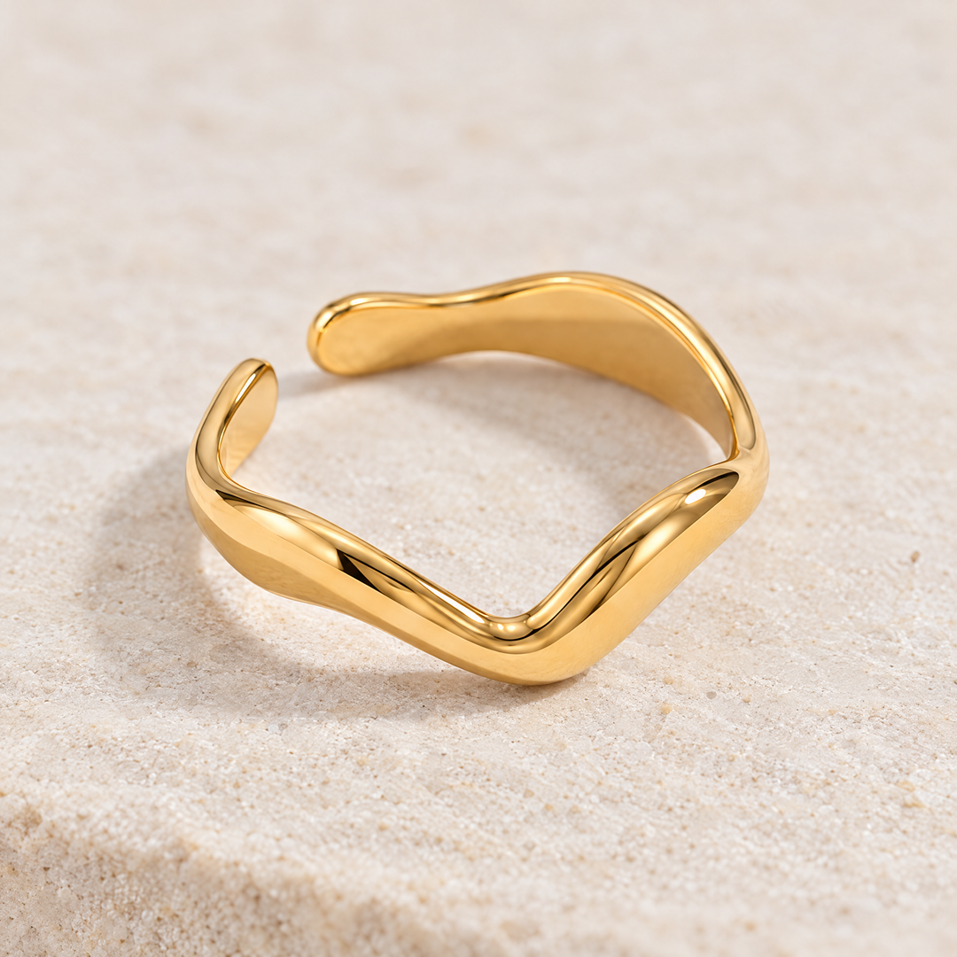 Close detail of the Vela Wave Ring, showing the texture and the band