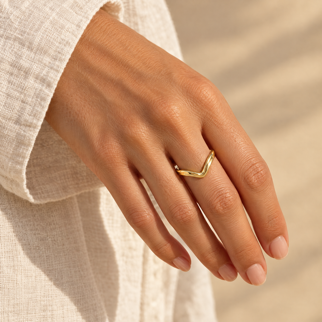The Vela Wave Ring worn, seen from the side in afternoon light