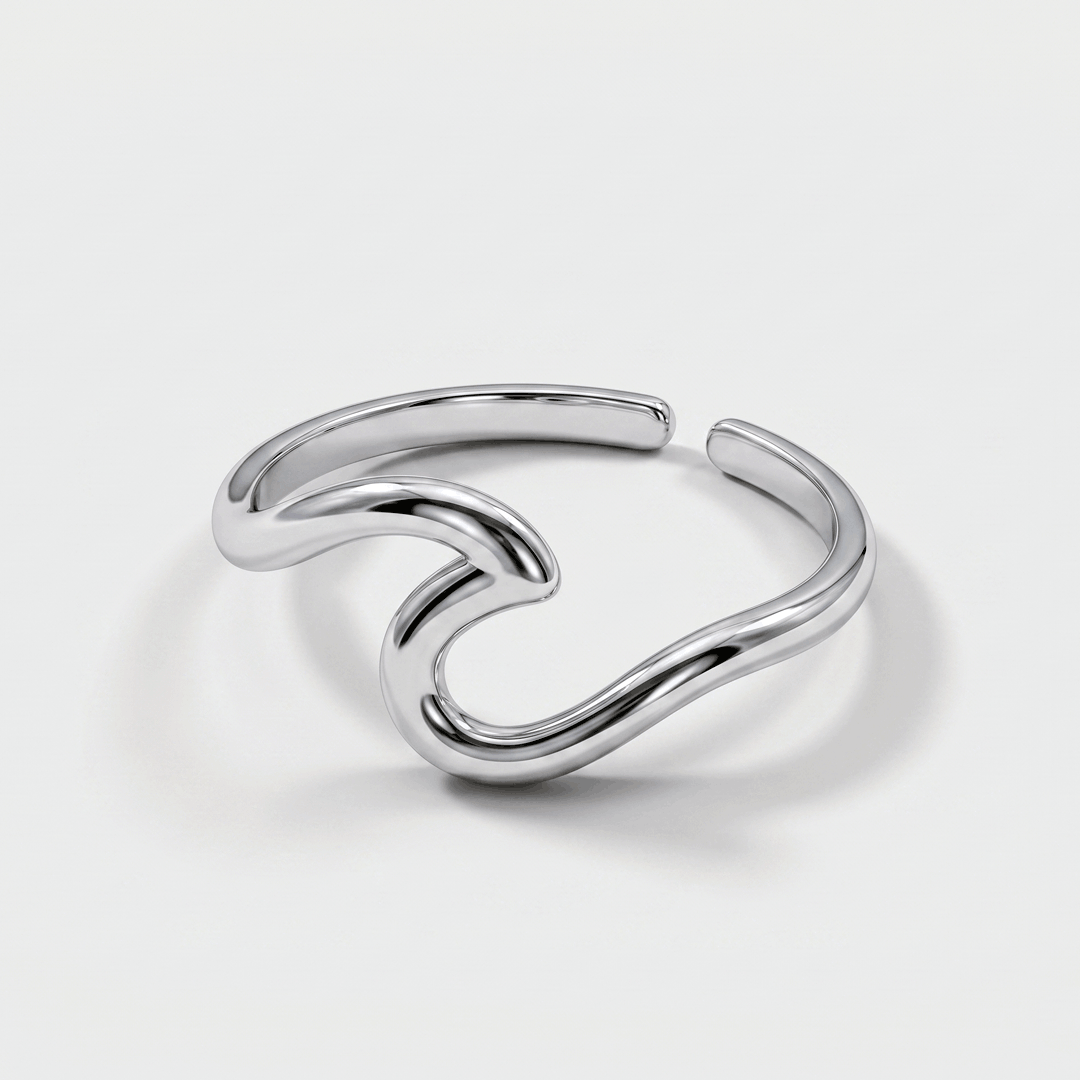 The wave ring in silver-tone stainless steel, on a plain background