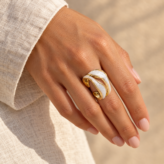 The Tide Wrap Ring worn, seen from the side in afternoon light
